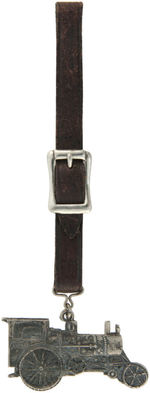 "AVERY" FIGURAL STEAM TRACTOR WATCH FOB WITH LOOP JOINING IT TO APPARENT ORIGINAL LEATHER STRAP.