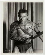 KIRK DOUGLAS SIGNED "SPARTACUS" PUBLICITY PHOTO.