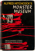 ALFRED HITCHCOCK SIGNED "ALFRED HITCHCOCK'S MONSTER MUSEUM" BOOK WITH SELF-PORTRAIT SKETCH.