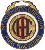 "IHC/McCORMICK-DEERING FARM MACHINES" ENAMEL AND BRASS WATCH FOB.