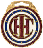 OUTSTANDING INTERNATIONAL HARVESTER COMPANY ENAMEL ON BRASS WATCH FOB.