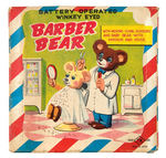 "BATTERY OPERATED WINKEY EYED BARBER BEAR" BOXED BATTERY TOY.