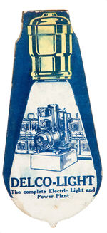 "DELCO-LIGHT" FIGURAL CARDBOARD WHISTLE.