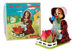 "LADY PUP TENDING HER GARDEN" BOXED BATTERY TOY.