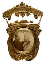 CLEVELAND/THURMAN 1888 HUGE BRASS SHELL BADGE WITH GLASS ENCLOSED PORTRAITS.