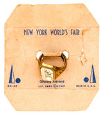"N.Y. WORLD'S FAIR" BRASS RING WITH CELLULOID TOP.