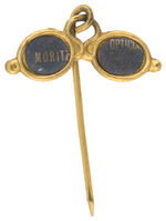 OPTICIAN’S UNUSUAL AND EARLY FIGURAL SPECTACLES ADVERTISING STICKPIN.