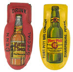 “FORT PITT” AND “PENN SPECIAL” PAIR OF BEER BOTTLE-DESIGNED CLICKERS.