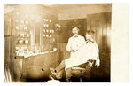 EARLY BARBERSHOP INTERIOR REAL PHOTO POSTCARD.