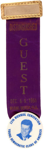 KENNEDY BUTTON SUSPENDED FROM "DISTINGUISHED GUEST" 1961 RIBBON.