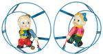 CELLO BOY AND GIRL IN WIRE HOOPS WIND-UP PAIR.