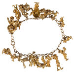 KRASNE CO. 10K GOLD CHARM BRACELET WITH 16 DISNEY CHARACTERS FROM 1946.