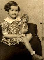 PHOTO OF CHILD WITH SHIRLEY TEMPLE DOLL.