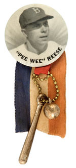 "'PEE WEE' REESE" STADIUM BUTTON WITH ORIGINAL ATTACHMENTS.