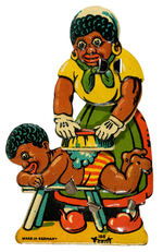 BLACK MAMMY WASHING BOY FIGURAL AND MECHANICAL DIE-CUT LITHO TIN CLICKER.