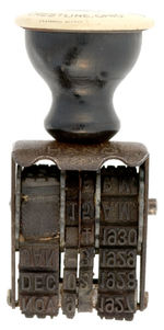 DATE INK STAMP DEVICE WITH CELLULOID HANDLE TOP PICTURING PLOW “THE NEW BURCH CRESTLINE, OHIO.