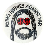 ANTI-DESERT STORM 1991 BUTTON READS “AGING HIPPIES AGAINST WAR.”