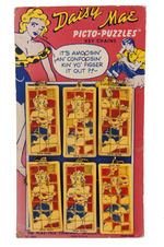 “LI’L ABNER/DAISY MAE PICTO-PUZZLES KEY CHAINS” SETS ON PAIR OF ORIGINAL STORE CARDS.