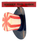 “REMEMBER PEARL HARBOR” CELLULOID PIN FEATURES THREE DIMENSIONAL UNCLE SAM’S TOP HAT.