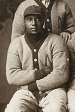 "1907 MANITOWOC" BASEBALL TEAM REAL PHOTO POSTCARD W/NEGRO LEAGUE STAR GEORGE WILSON.