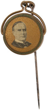 McKINLEY FOUR STICKPINS PLUS SPINNING CHARM SHOWING ROOSEVELT IN ROUGH RIDER UNIFORM.