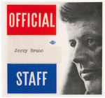 JOHN F. KENNEDY "OFFICIAL STAFF/JERRY BRUNO" LAMINATED PLASTIC BADGE.