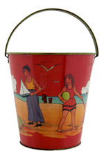 CHILDREN AT THE BEACH SAND PAIL.