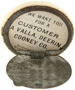 CELLULOID BUTTON-LIKE NOVELTY WITH TIN COMPARTMENT ON BACK FOR PILLS OR STAMPS.