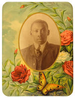 LARGE BEAUTIFULLY COLORED CELLULOID PORTRAIT PLAQUE OF YOUNG BLACK MAN.