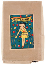 BETTY BOOP “BETTY’S ACROBAT” BOXED CELLULOID WIND-UP TRAPEZE TOY.