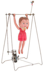 BETTY BOOP “BETTY’S ACROBAT” BOXED CELLULOID WIND-UP TRAPEZE TOY.