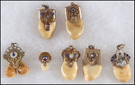 ELKS WATCH CHAIN CHARMS (7) WITH 5 TEETH IN 10K GOLD MOUNTS, INCLUDING RARE DOUBLE & BABY TOOTH.