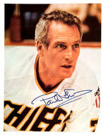 PAUL NEWMAN SIGNED "SLAP SHOT" MAGAZINE POSTER PAGE.