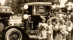 VINTAGE ORANGE CRUSH TRUCK PHOTO WITH CHILDREN.