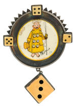 SUPERBLY CRAFTED FIRST SEEN YELLOW KID BADGE WITH DICE ACCENTS.