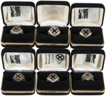 X-MEN LOGO GROUP OF SIX LIMITED EDITION STERLING SILVER RINGS.