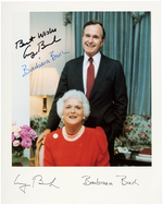 GEORGE AND BARBARA BUSH SIGNED PHOTO OF COUPLE IN THE WHITE HOUSE LIVING ROOM.