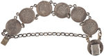 LOVE TOKEN BRACELET MADE OF SEATED LIBERTY DIMES WITH GOLD INITIALS.