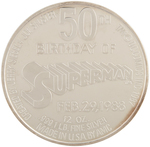 SUPERMAN 50th ANNIVERSARY SILVER POUND MEDALLION IN PRESENTATION CASE.