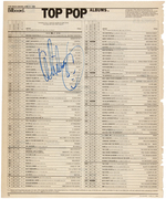 WHITNEY HOUSTON SIGNED "BILLBOARD TOP POP ALBUMS" CHART PAGE.