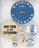 SIX STEVENSON BUTTONS AND PAPER "WALKING WITH STEVENSON" BADGE.