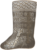 WONDERFUL CHRISTMAS STOCKING FIGURAL BADGE FROM 1890 "NEW YORK WORLD'S LITTLE ST. NICK SOCIETY."