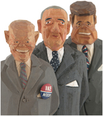 JOHN ERICKSON AND URBAN GUNNERSSON CARVED WOOD FIGURES OF IKE, KENNEDY AND JOHNSON.