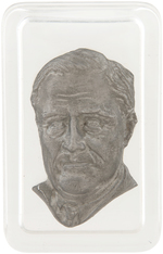 SMILING FDR HIGH RELIEF PORTRAIT ON OVAL PLASTER WALL PLAQUE AND PAIR OF PAPERWEIGHTS.