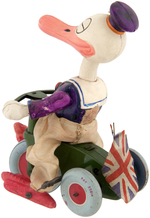 DONALD DUCK ON TRICYCLE WIND-UP WITH BRITISH UNION JACK FLAG.
