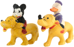 MICKEY MOUSE & DONALD DUCK RIDING PLUTO BISQUE/PLASTER-FILLED CELLULOID PAIR.