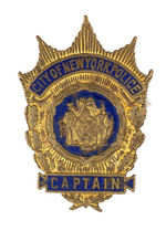 "CAPTAIN/CITY OF NEW YORK POLICE" ENAMEL ON BRASS BADGE.