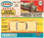 "AURORA SUPER MODEL MOTORING - '57 CHEVY COUPE" CARDED SLOT RACING CAR.