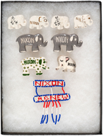 GROUP OF EIGHT NIXON CERAMIC ELEPHANTS AND BEADED BADGE.