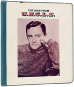 MAN FROM U.N.C.L.E. VINYL 3-RING BINDER AND TWO PACKS OF BOOK COVERS.